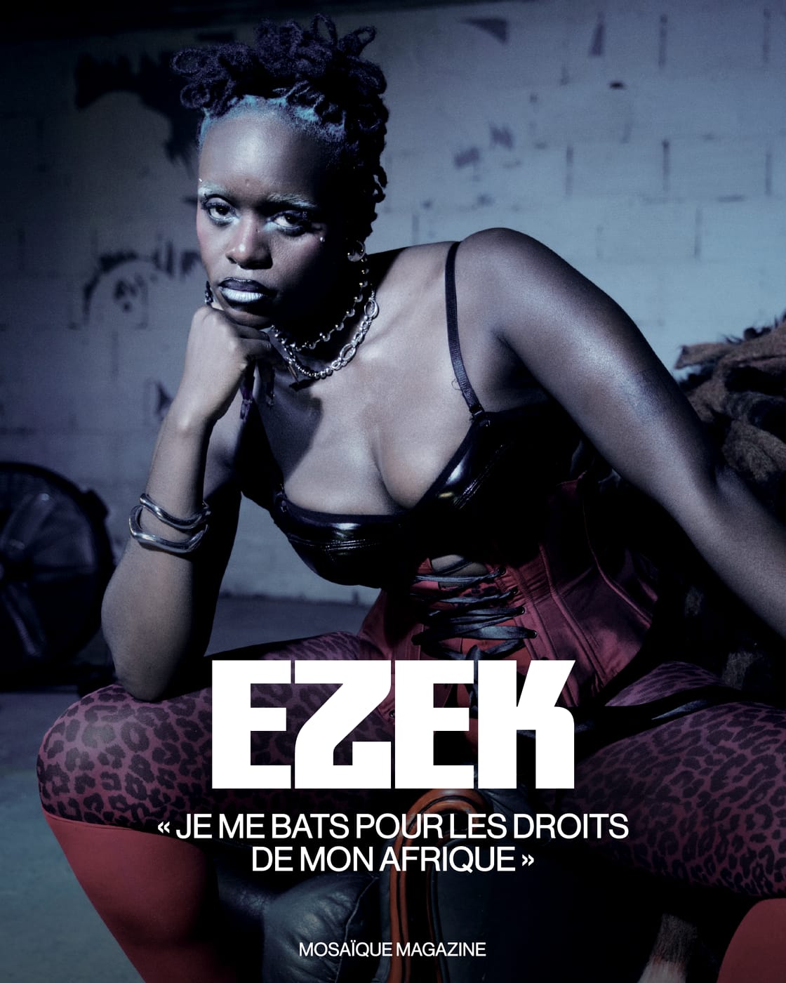 Mosaïque Magazine card: Ezek seated in red corset and leopard tights, titled Je me bats pour les droits de mon Afrique