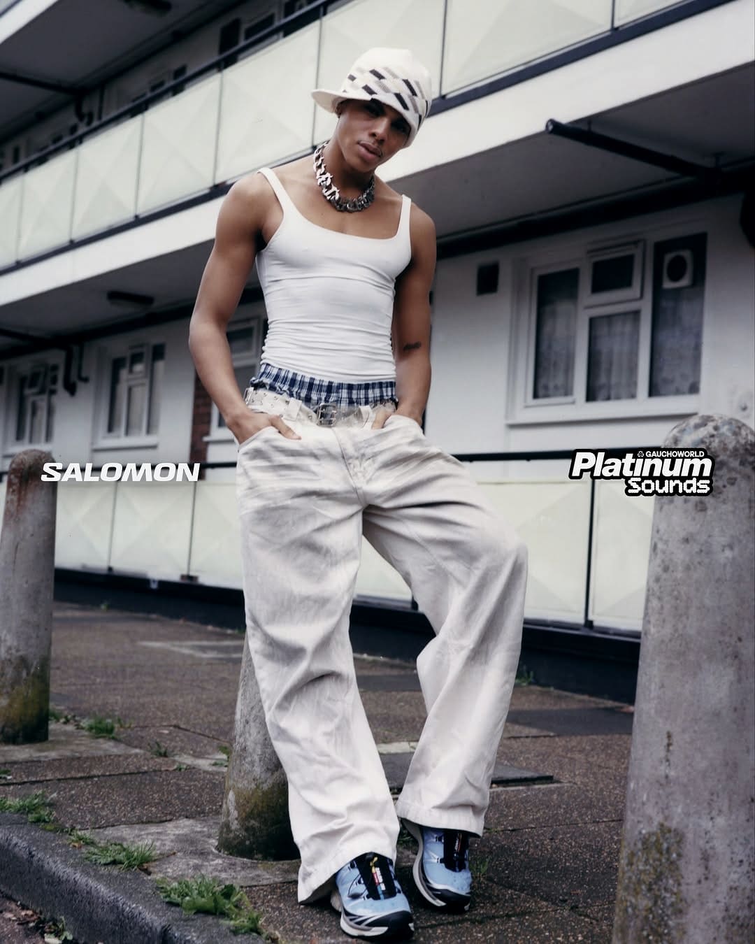 Oluwa in the Salomon × Gauchoworld shoot, white tank and Salomon shoes on a London street